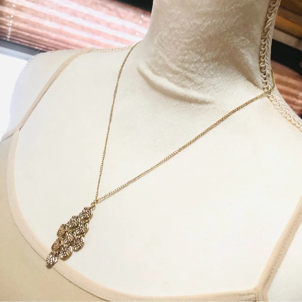 Shiny gold waterfall articulated pendant on chain necklace